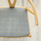 a heather gray windowpane check upholstered chair seat