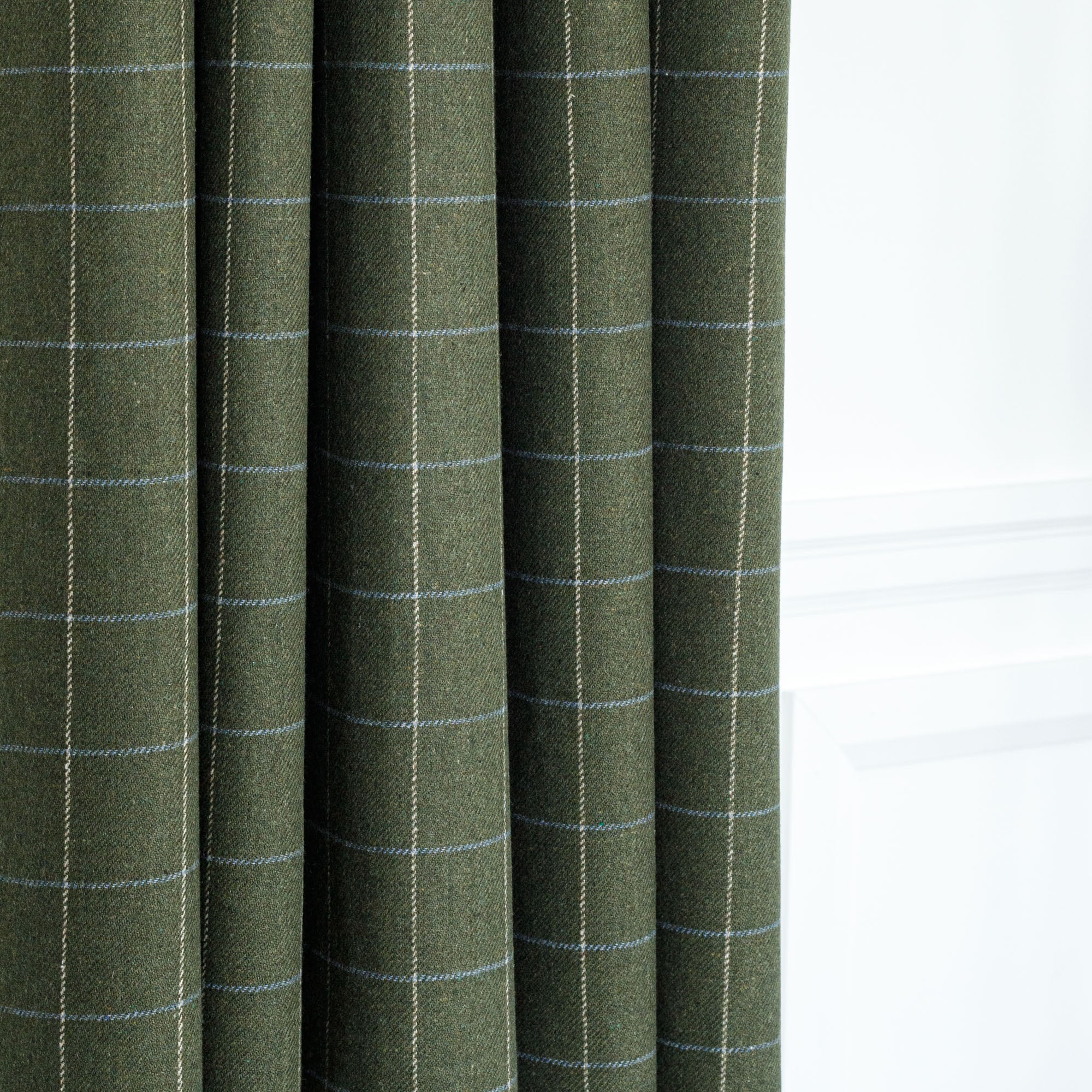 a moss green, beige and light blue drapery fabric from Tonic Living