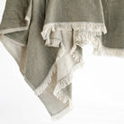 Tonic living olive green and natural linen cotton throw blanket with a delicate fringe edge