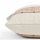 a cream and rusty red patterned stripe throw pillow : close up side view