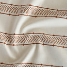 a rusty red and cream woven south west patterned stripe