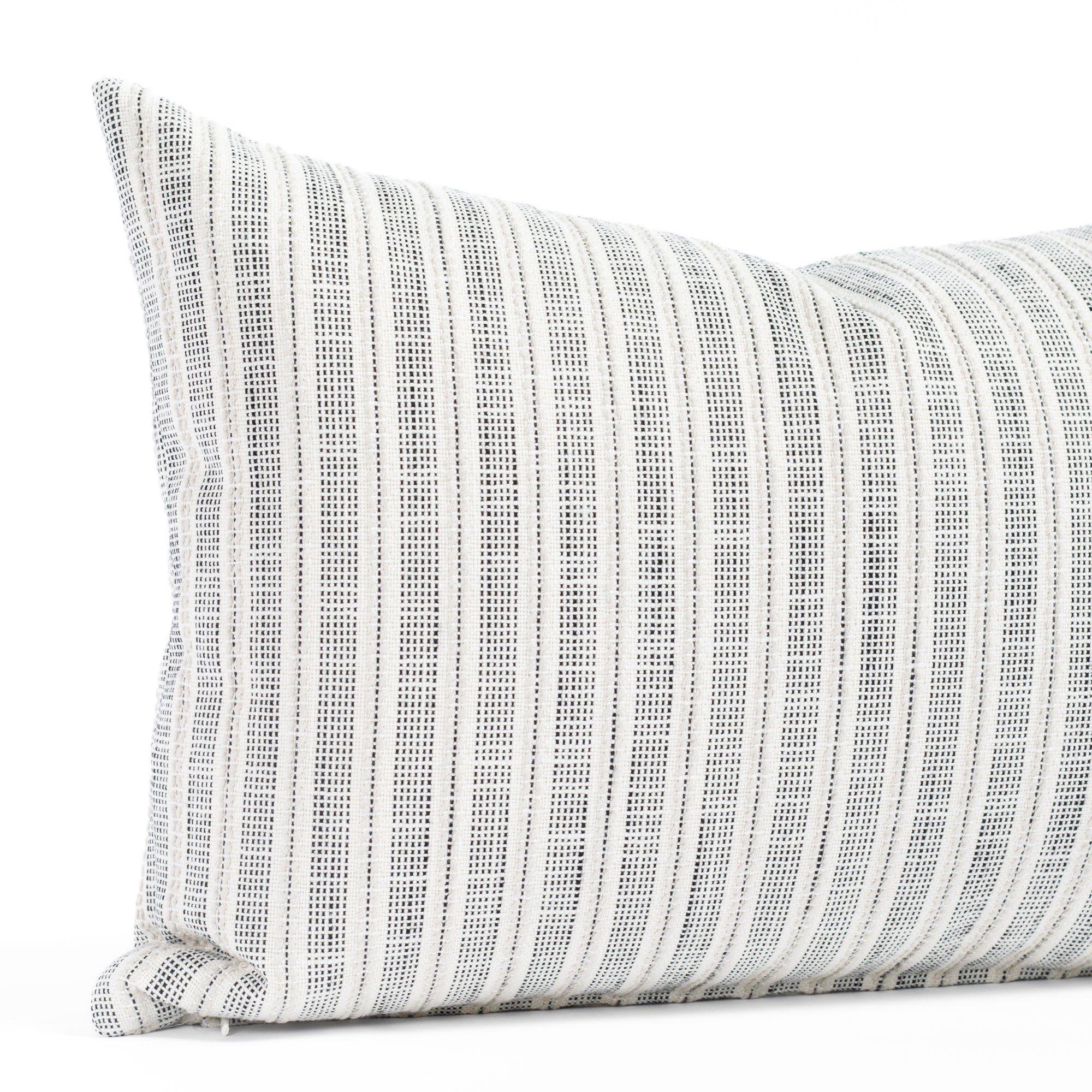 a cream and black striped lumbar throw pillow: close up view