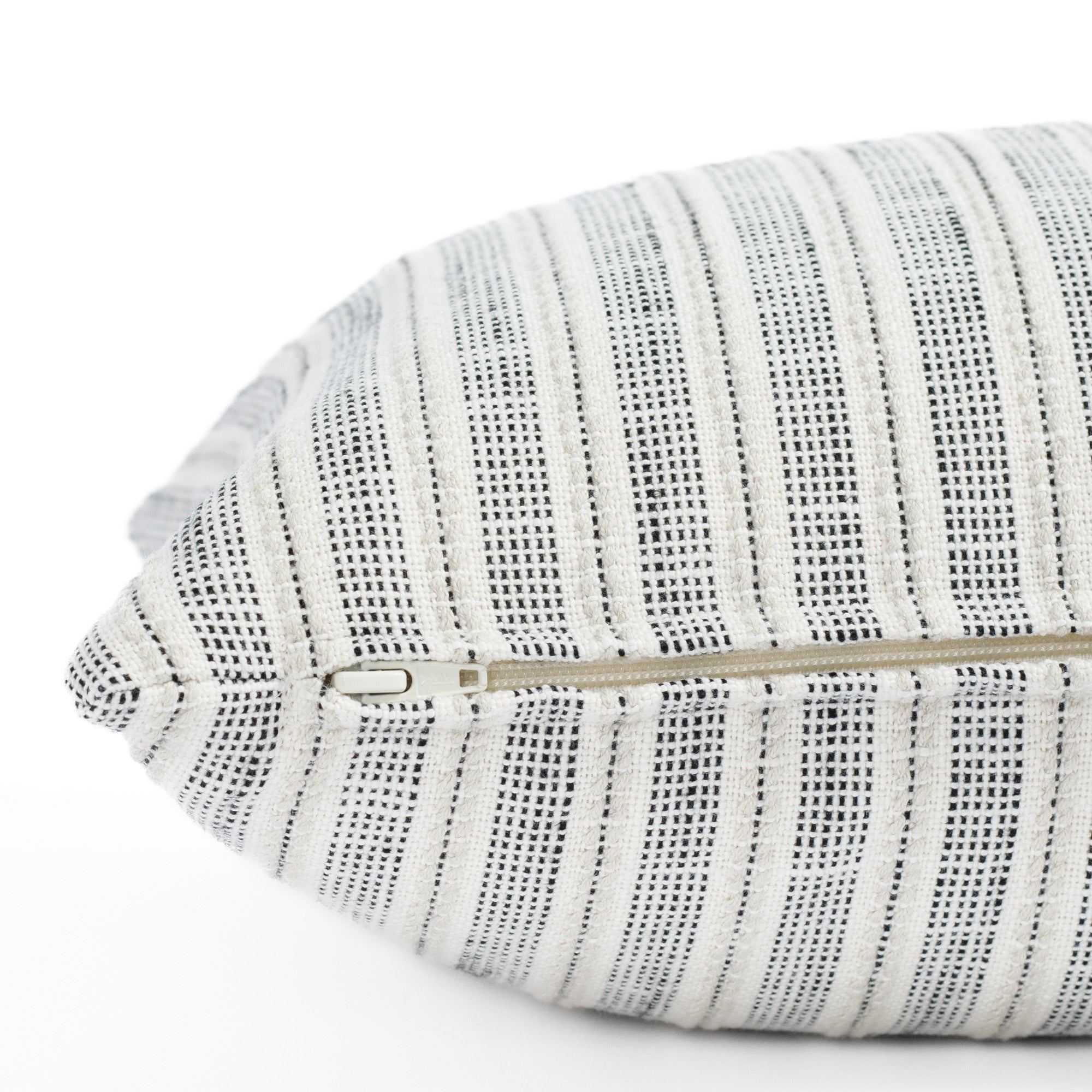 cream and black striped throw pillow : close up zipper view