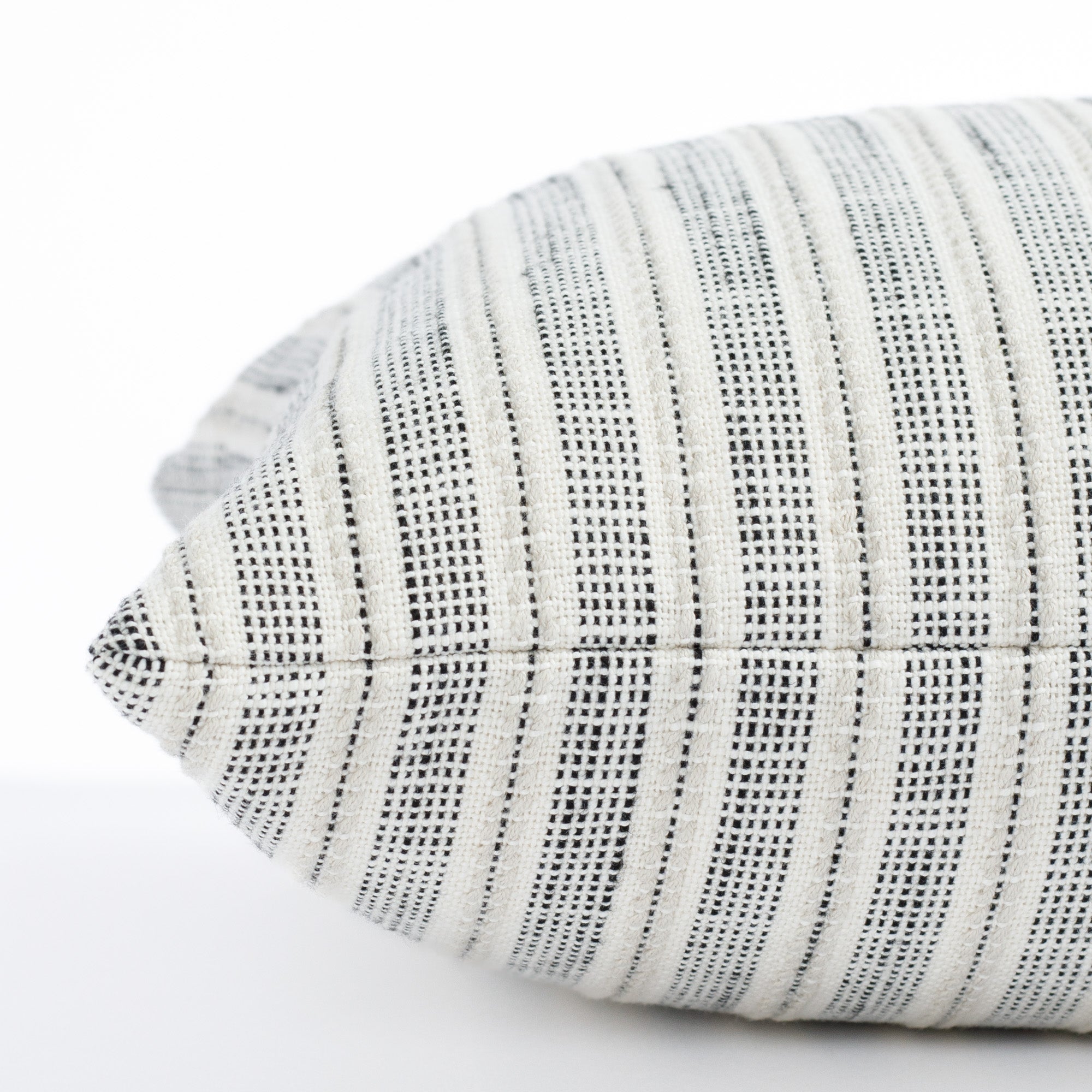 cream and black striped throw pillow : close up side view