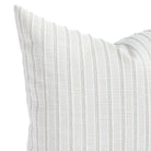 a white and sand stripe outdoor throw pillow : close up view