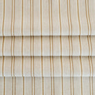 a beige, cream, ochre yellow and tan brown striped multi use home decor fabric