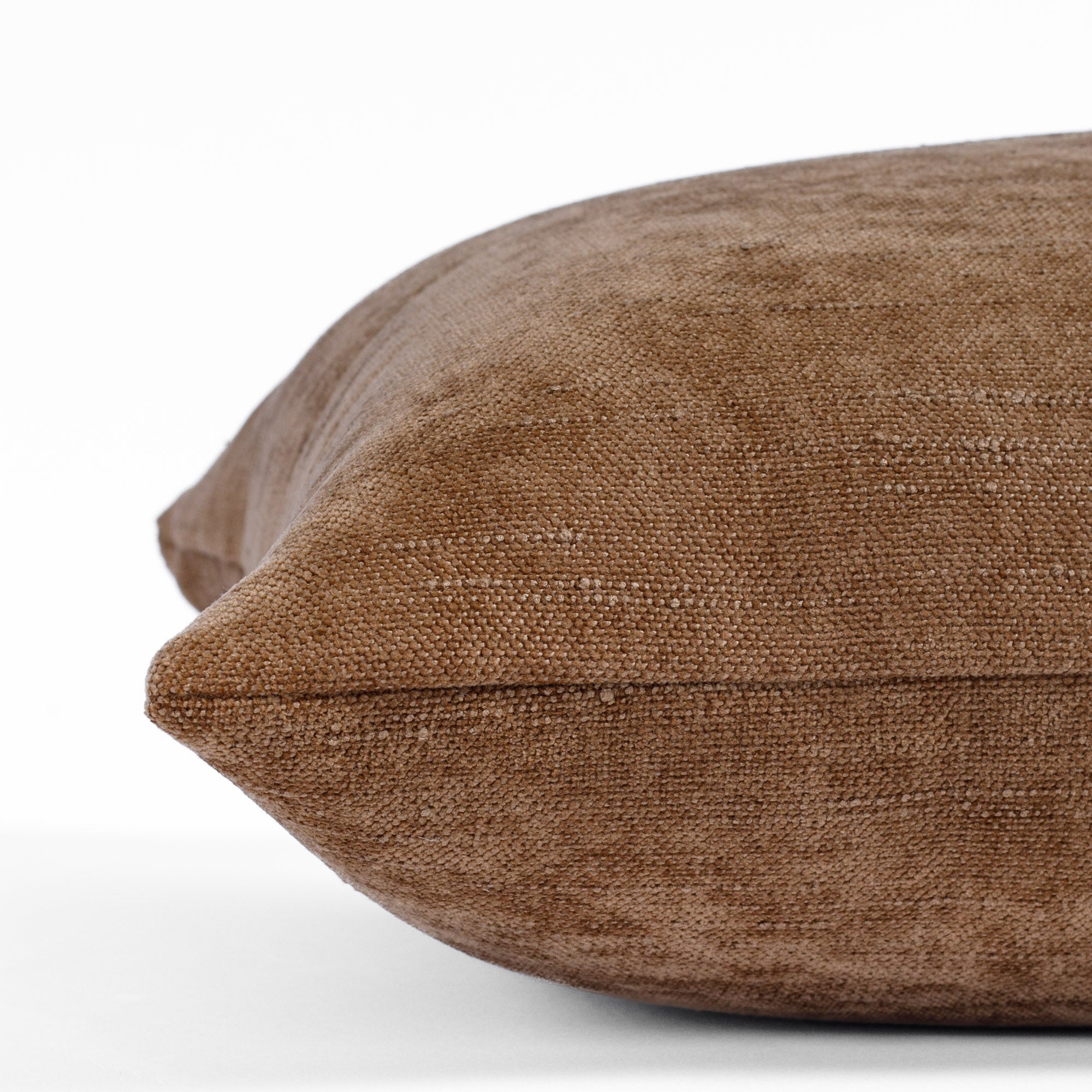 a cinnamon brown chenille lumbar pillow : close up side view