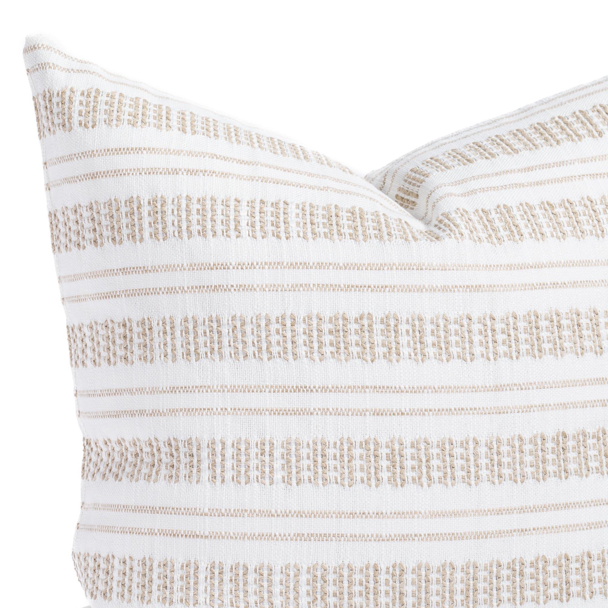 a white and tan striped throw pillow - close up view