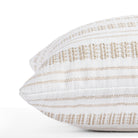 a white and tan striped throw pillow - close up side view