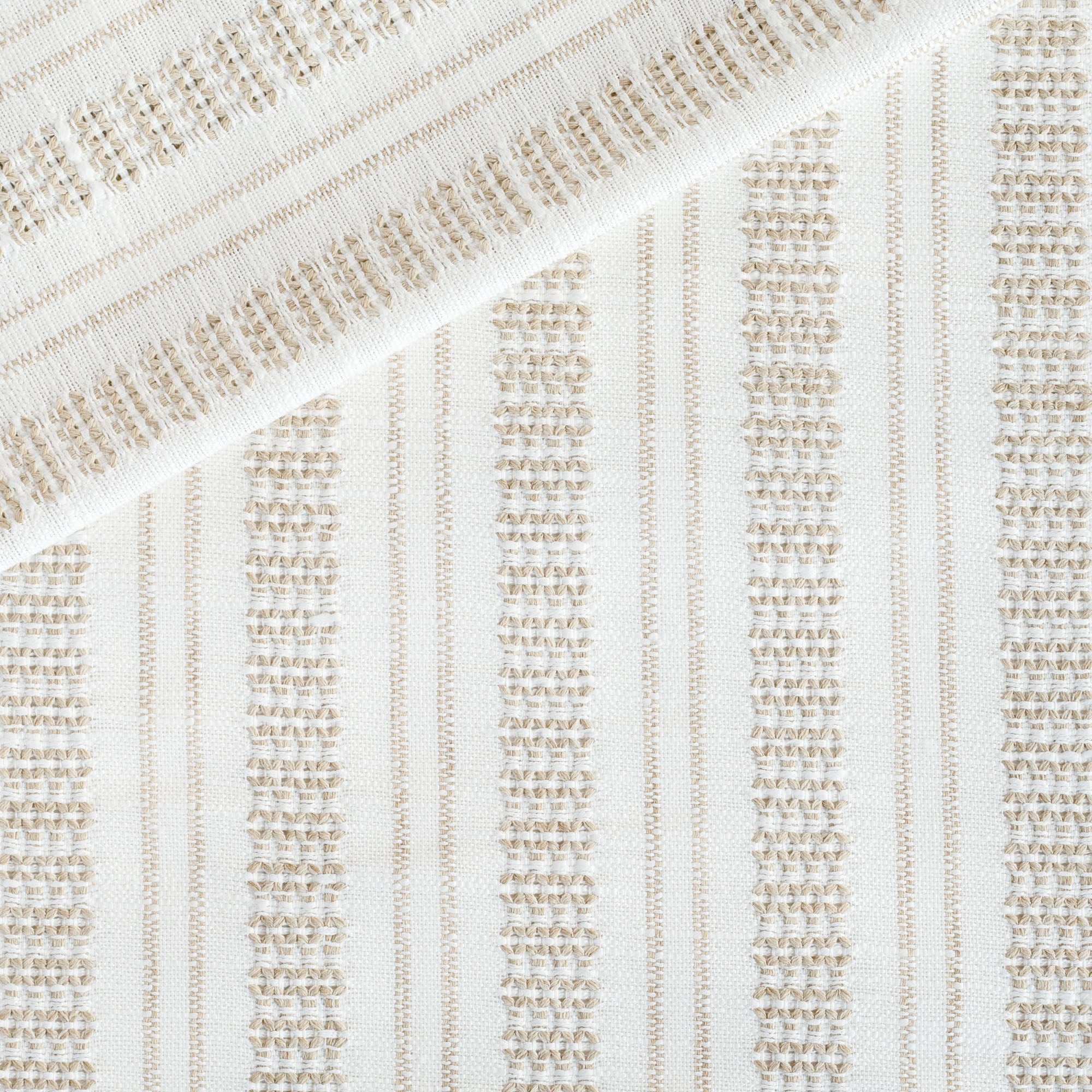 a white and tan intricate woven striped home decor fabric