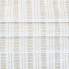 a white and beige woven stripe patterned home decor fabric