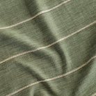 a leafy green with chunky wheat colored horizontal stripe upholstery fabric 