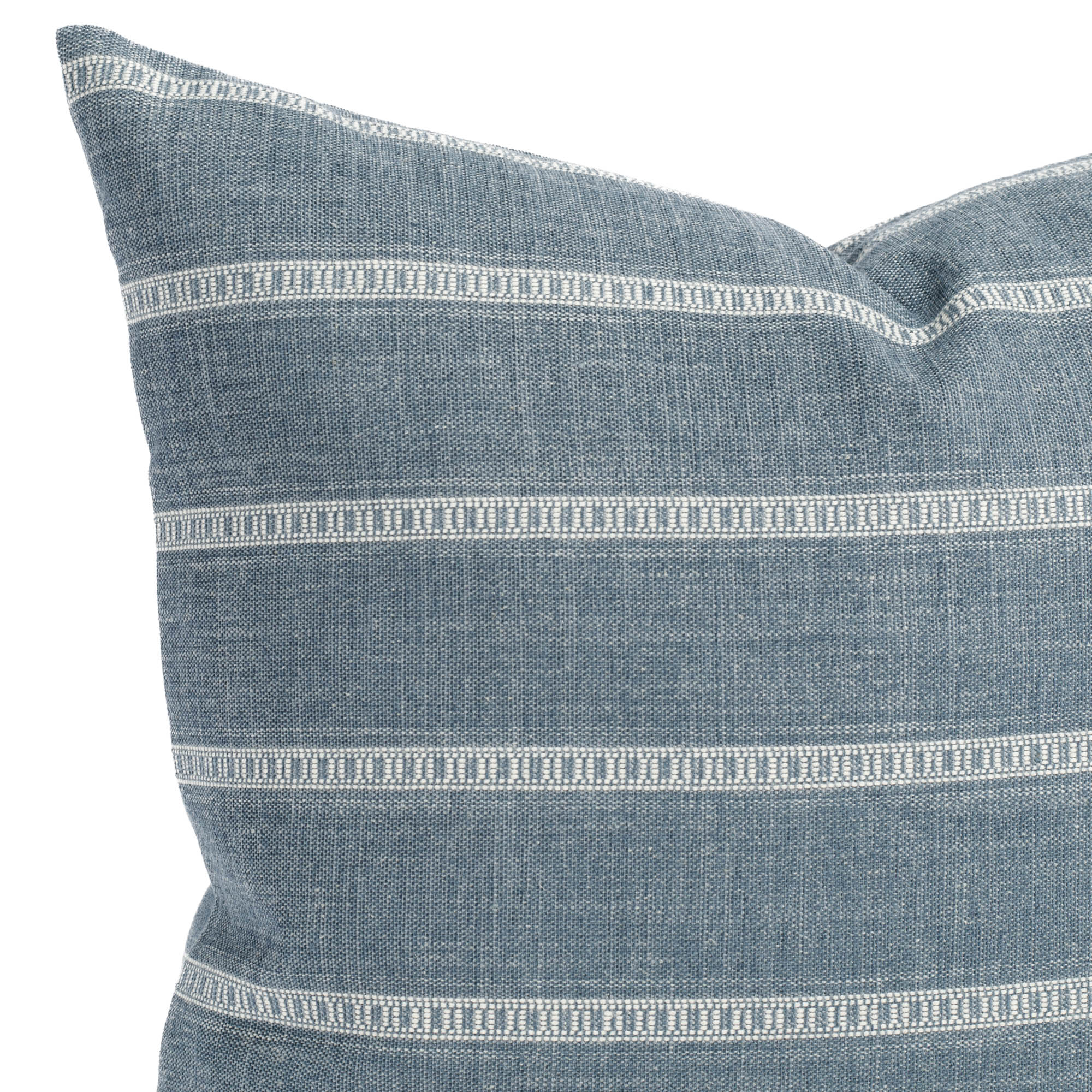 A blue and white striped pillow: close up view.