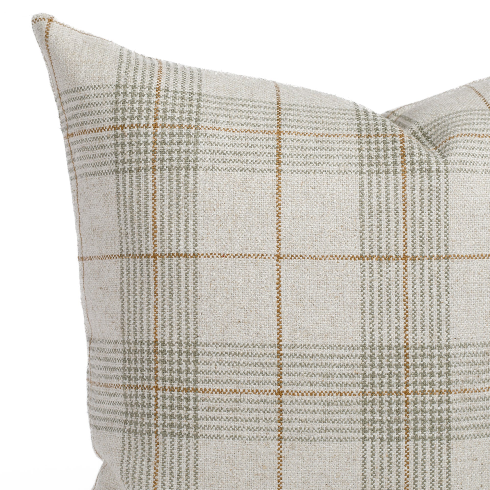 A sage green, oatmeal and caramel plaid throw pillow: a close up view.