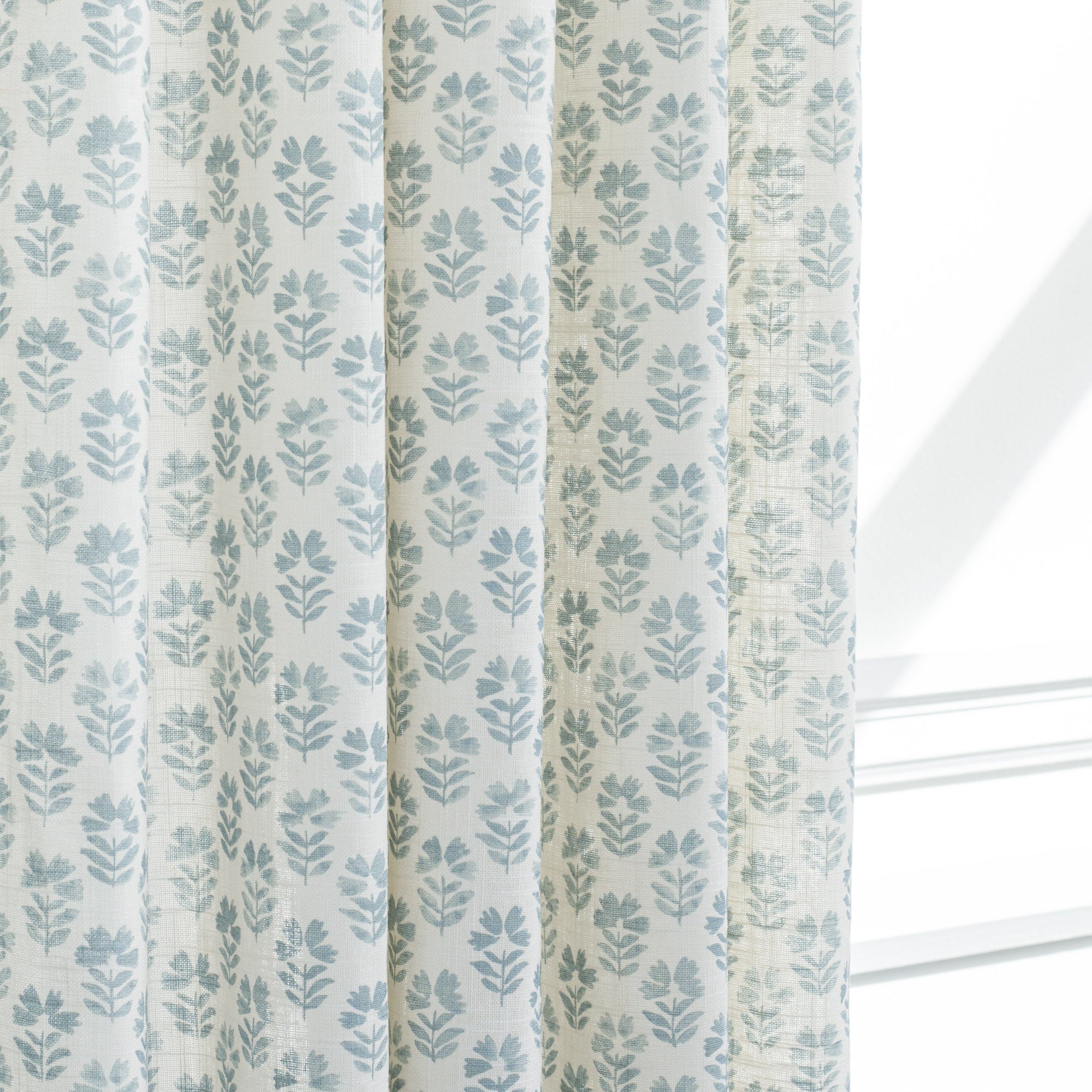 Carmel Sky Blue, a drapery fabric from Tonic Living with a block print floral pattern.