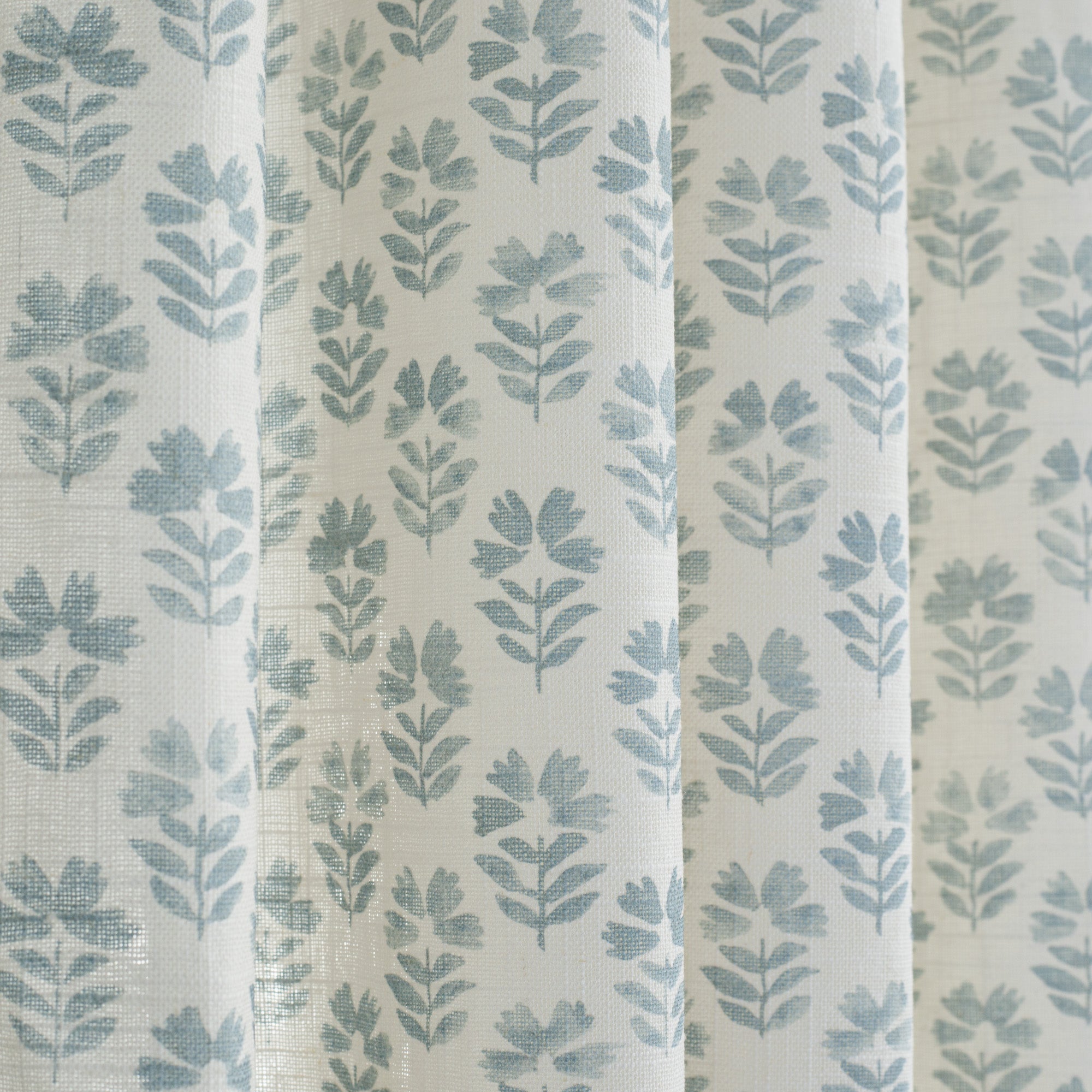 Cream and light blue linen-blend curtain fabric from Tonic Living.