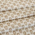 an oatmeal and brown floral block-print drapery fabric