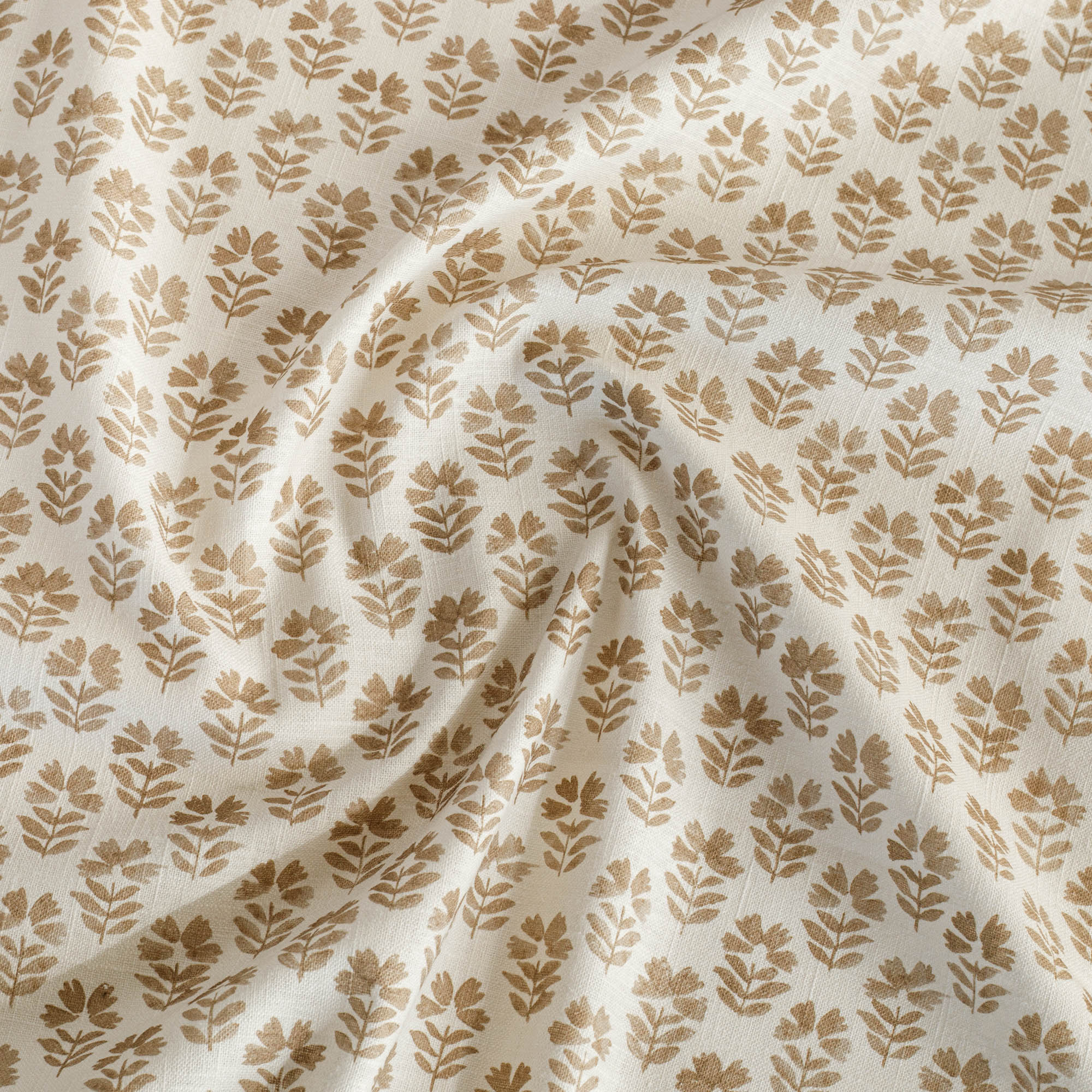 an oatmeal and brown floral block-print drapery fabric