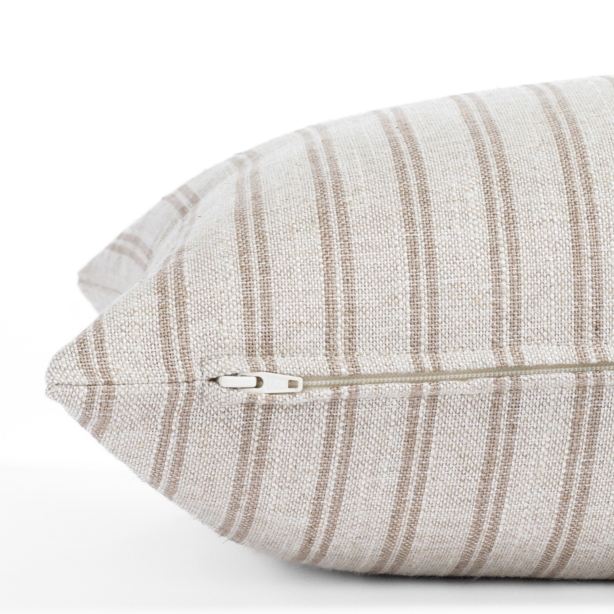 a cream and brown stripe extra long lumbar pillow : close up zipper view