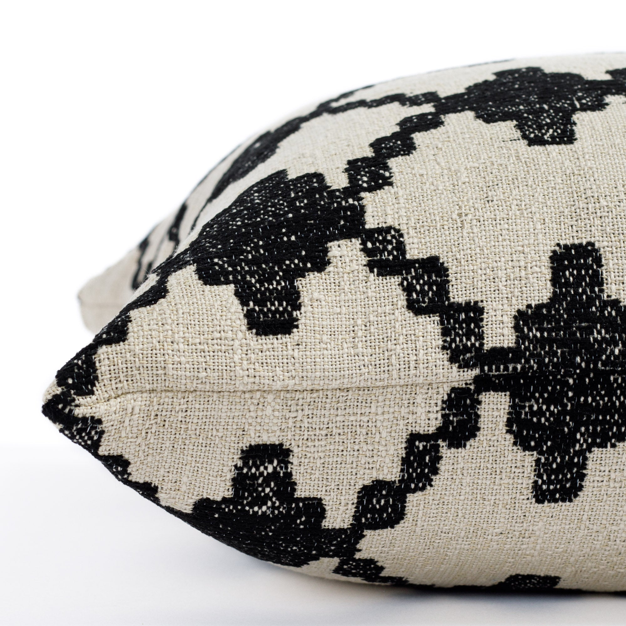 a black and burlap diamond trellis global patterned pillow : close up side view