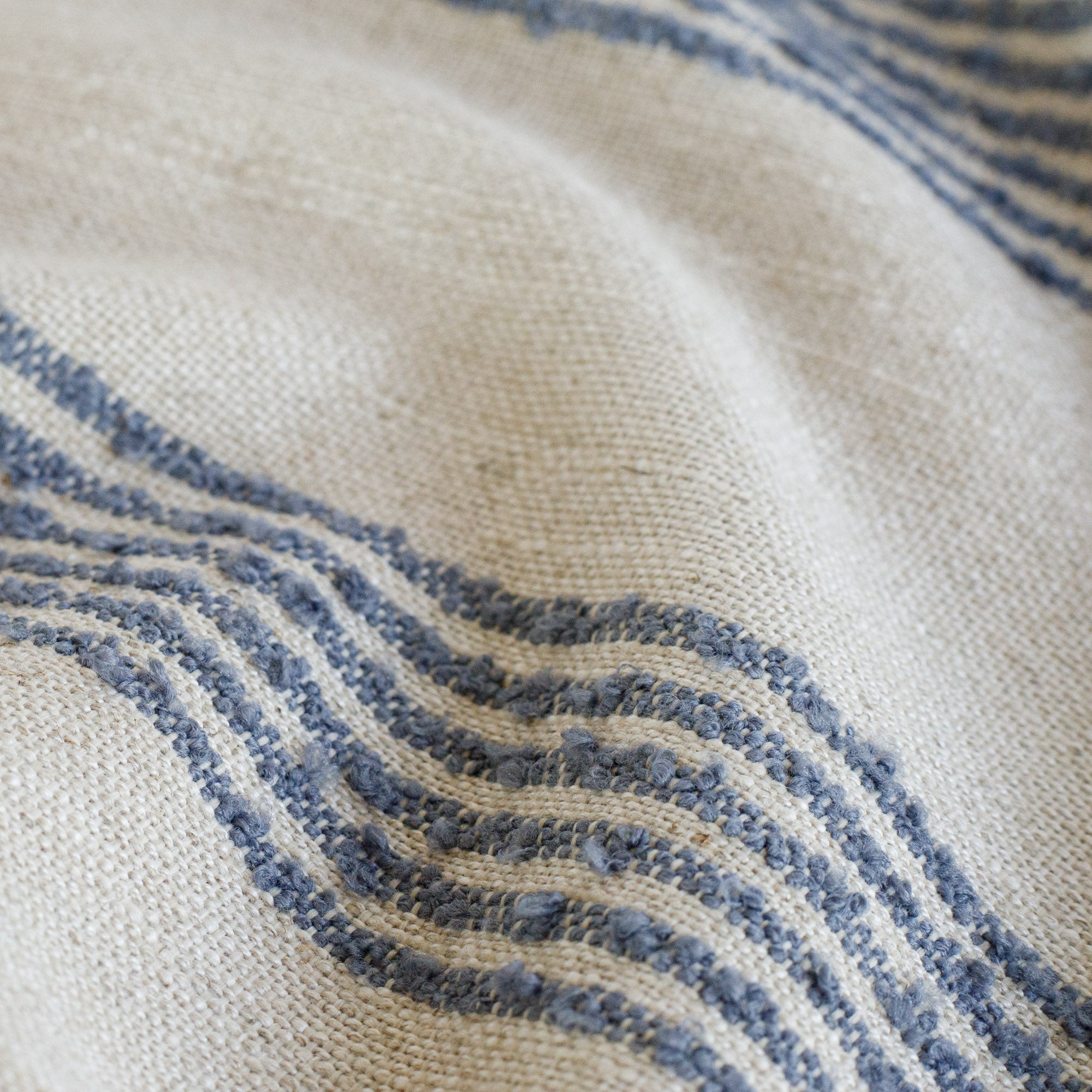 an oatmeal and denim blue stripe fabric : close up view