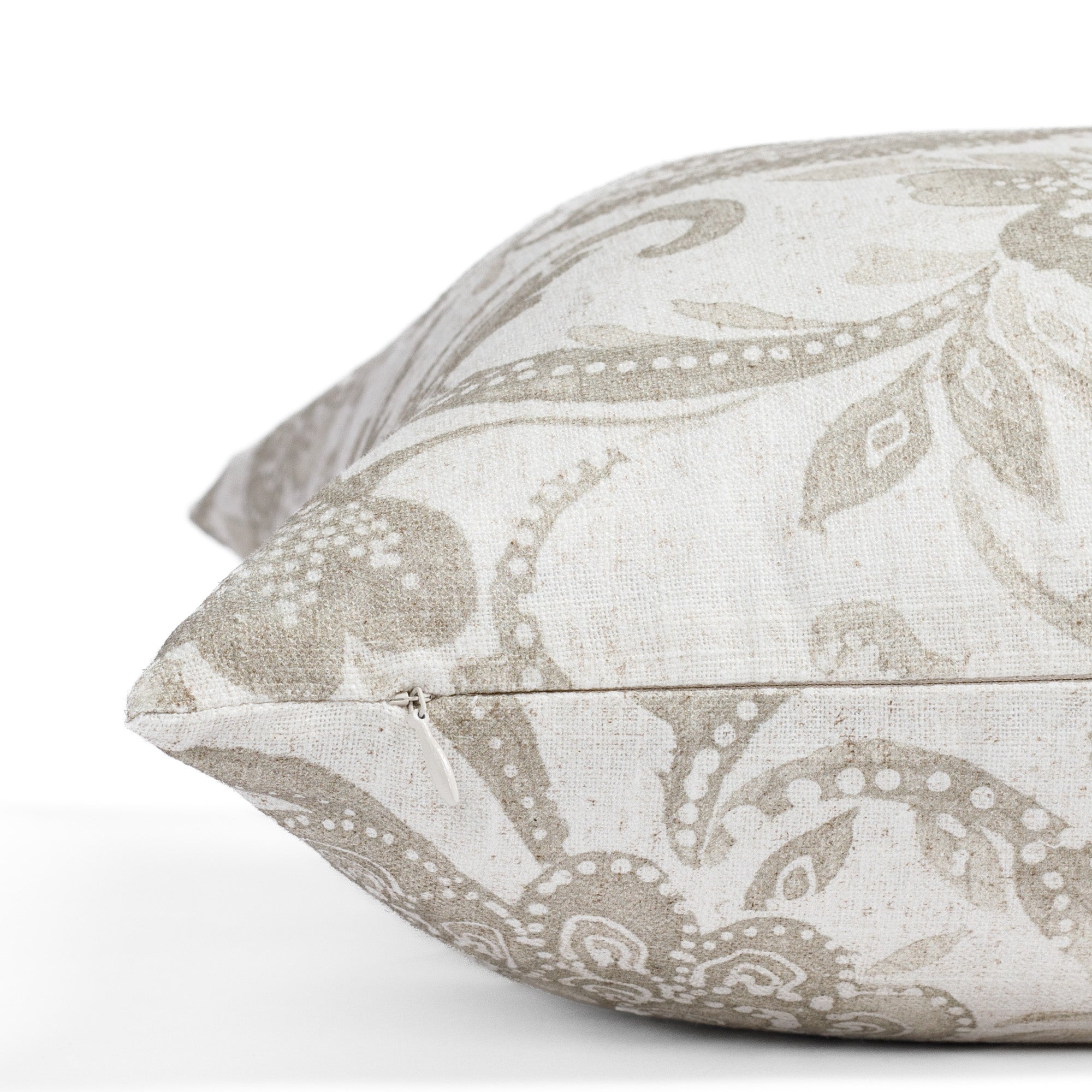 an earthy grey floral print pillow : close up zipper view