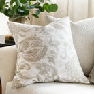 a taupe grey and oatmeal cream floral print throw pillow