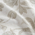 an oatmeal and earthy gray floral print multi purpose fabric : close up view