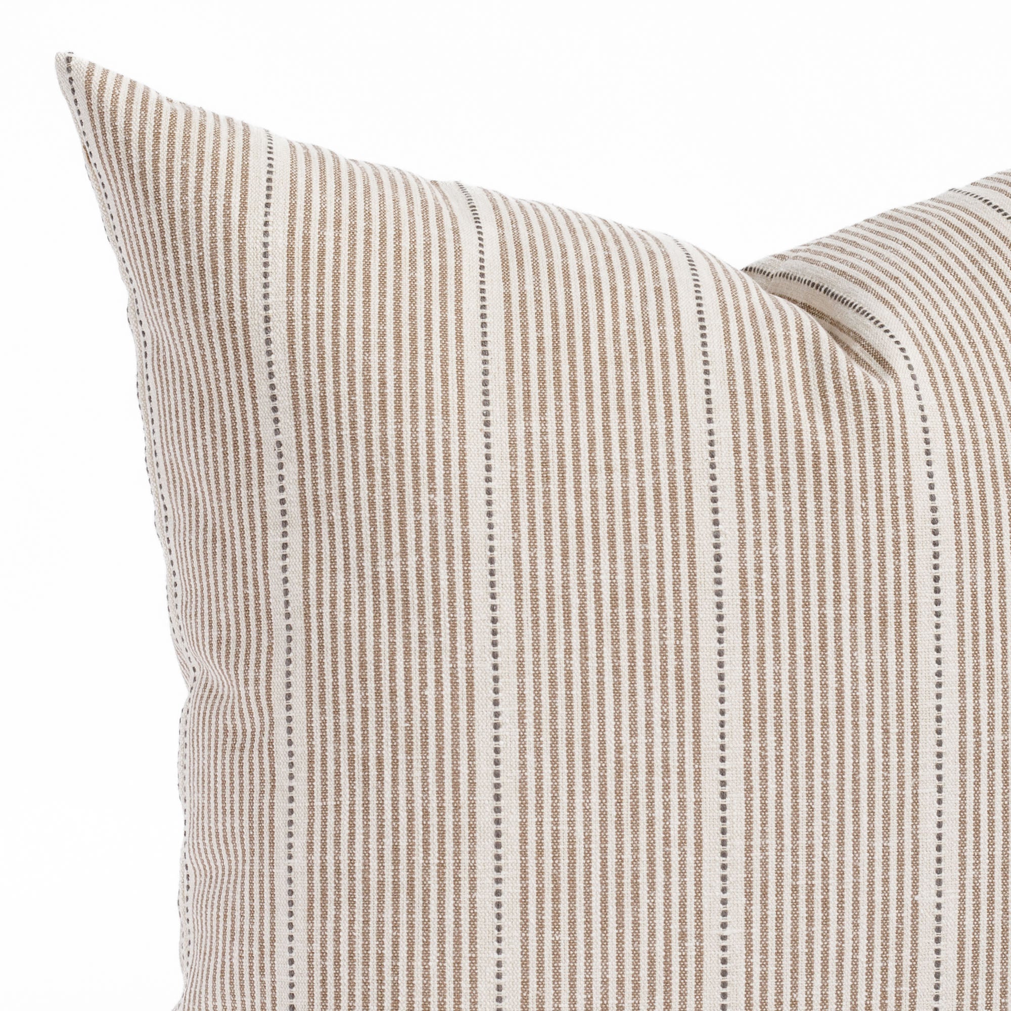 a brown, cream and black throw pillow - close up view