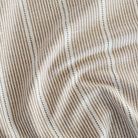 a brown, cream and black stripe patterned home decor fabric 