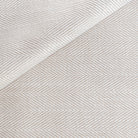 a cream and beige herringbone performance fabric 