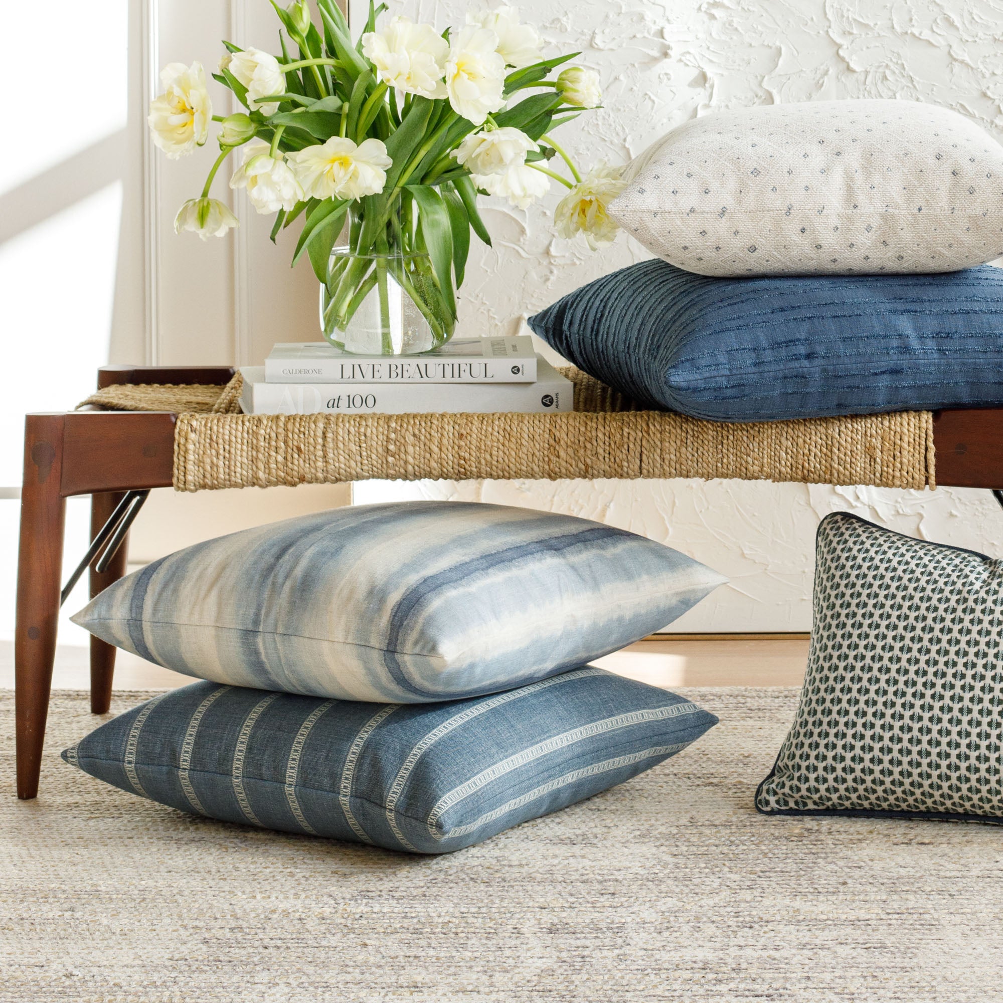 A selection of blue patterned designer pillows from Tonic Living.