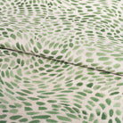 Mazzy Greenstone, a green swirl print fabric from Tonic Living