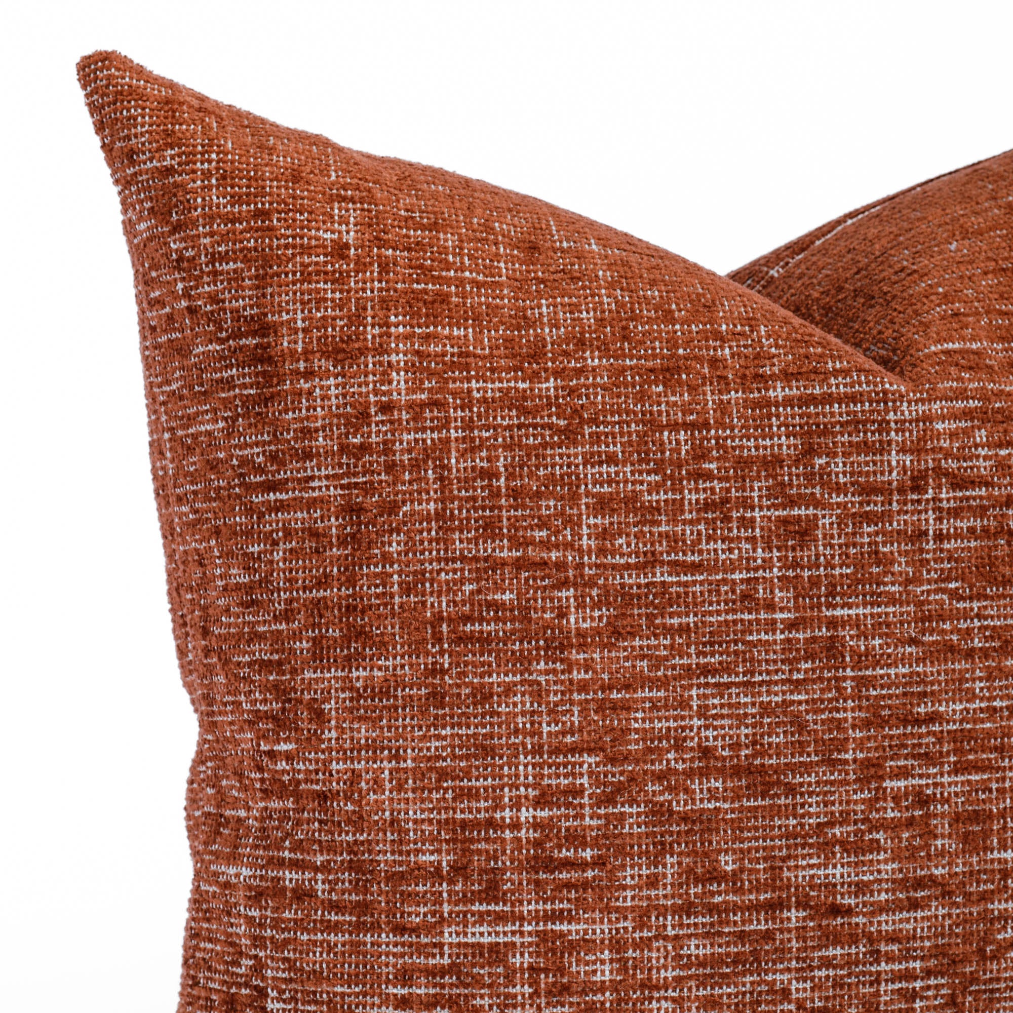 a rust red throw pillow : close up view