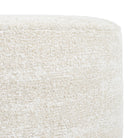 a creamy beige round ottoman - close up side view