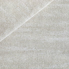 a cream textured flatweave and boucle stain resistant upholstery fabric