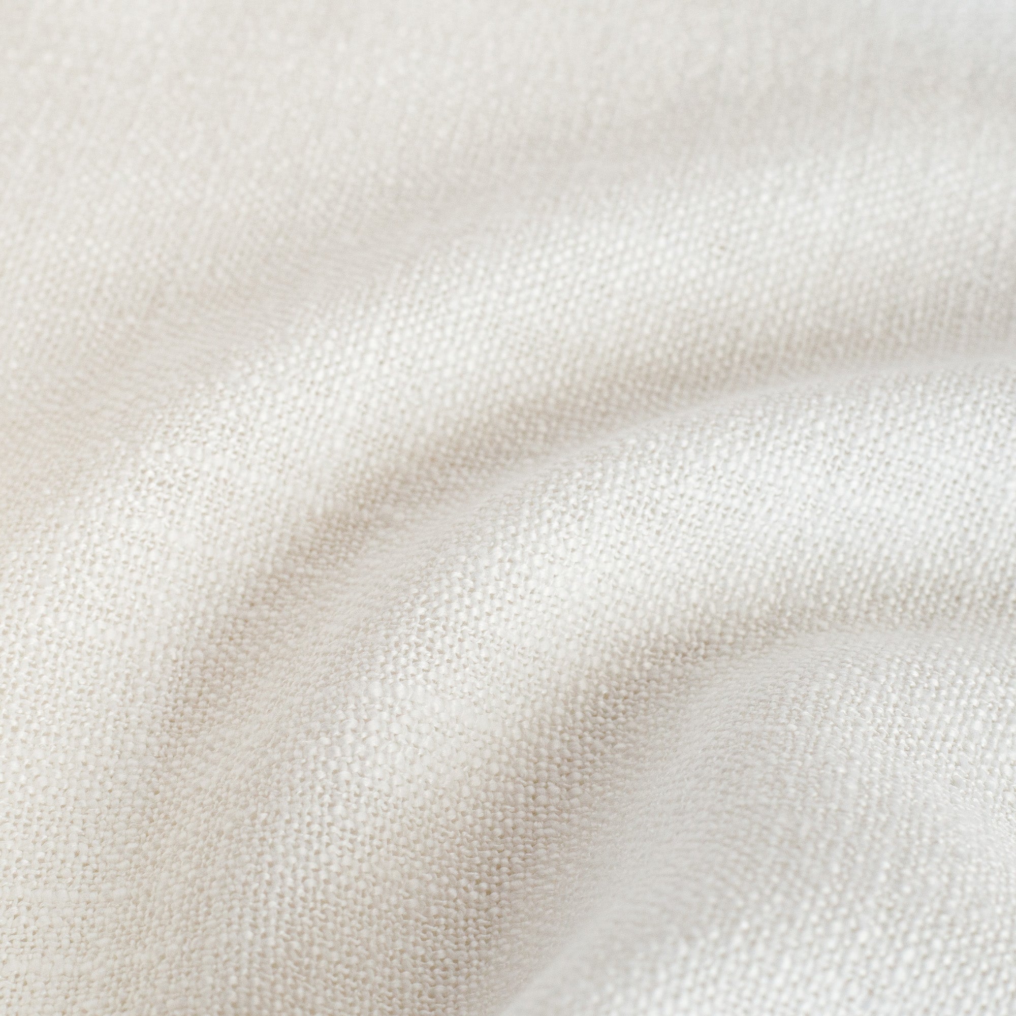 a semi sheer cream curtain fabric - close up view